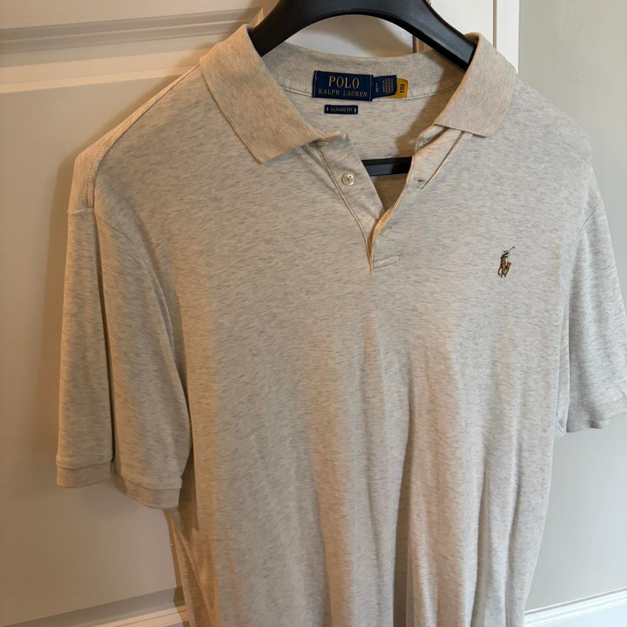 חולצת פולו שמנת · Polo Ralph Lauren